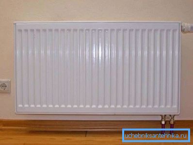 Wall-mounted steel water convector with mechanical thermostat. Wall-mounted steel water convector with mechanical thermostat.