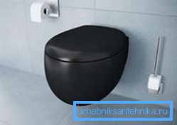 Rounded shapes of black toilet in modern style Rounded shapes of black toilet in modern style