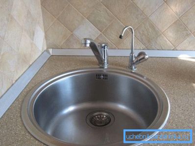 Separate tap for drinking water on the tabletop next to the sink. Separate tap for drinking water on the tabletop next to the sink.