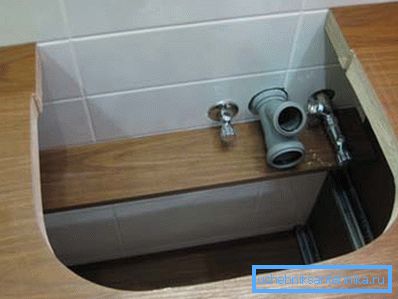 The hole under the sink in the table top cabinets with installed inputs of communication systems The hole under the sink in the table top cabinets with installed inputs of communication systems