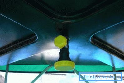 Plastic storage tank with water-spreading watering can, as the ceiling of the summer shower. Plastic storage tank with water-spreading watering can, as the ceiling of the summer shower.