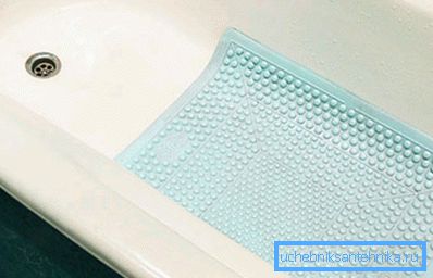 Laying on the bottom of the bathroom.
