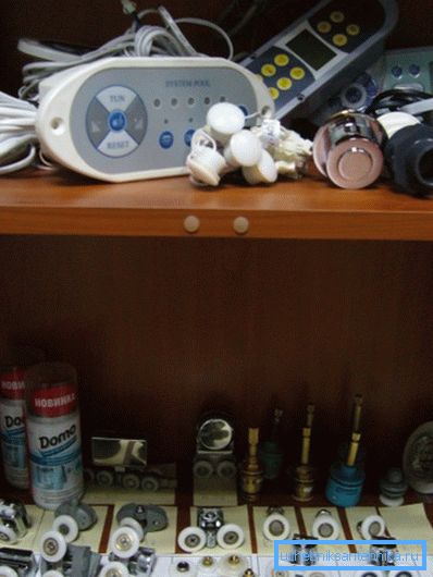Shelf in a specialized store with spare parts for showers Shelf in a specialized store with spare parts for showers