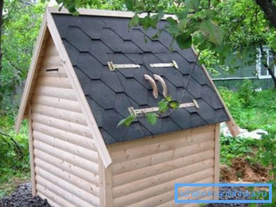 A fully enclosed well house serves as a well cover. A fully enclosed well house serves as a well cover.