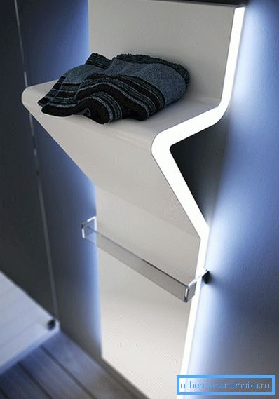 Heated towel rail with a shelf