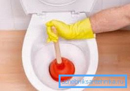 Puncing a garbage plug with a plunger Puncing a garbage plug with a plunger