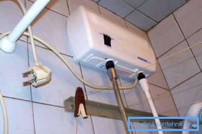 Flow-through electric shower water heater