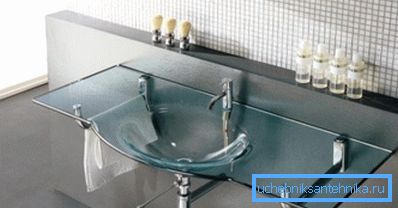 Transparent bathroom sink in a minimalist interior Transparent bathroom sink in a minimalist interior