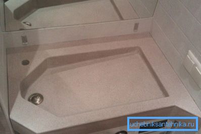 Sink over a washing machine made of artificial stone - an example of rational use of space