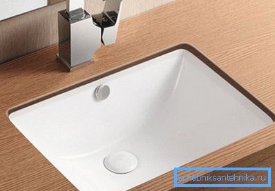 Sink - built into the countertop in the bathroom, it looks stylish and modern. Sink - built into the countertop in the bathroom, it looks stylish and modern.