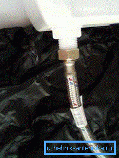 The location of the supply hose at the bottom is a characteristic feature of this variant.