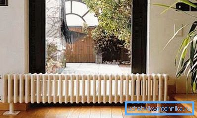 Steel tubular radiator in the interior of the dwelling Steel tubular radiator in the interior of the dwelling