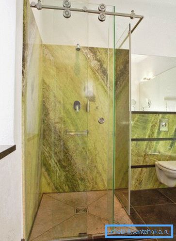 Glass sliding doors in the shower in the bathroom Glass sliding doors in the shower in the bathroom