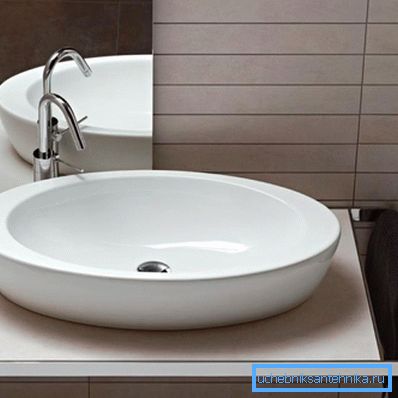 Countertop under the sink in the bathroom with towel rail
