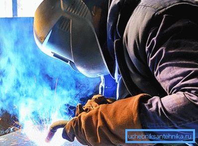 Welding in argon environment. The smoke rising above the seam is not so good for the welder's health.
