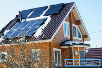 Solar collectors are installed on top, just below - panels with photocells Solar collectors are installed on top, just below - panels with photocells