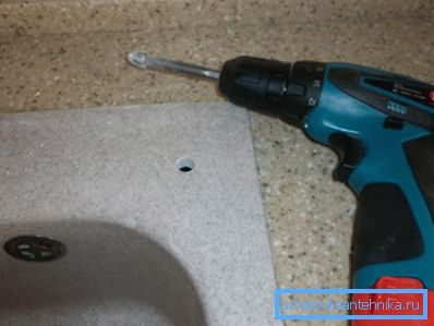 Drilling holes in the worktop.