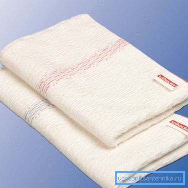 Rag to wipe the surface of a black toilet bowl Rag to wipe the surface of a black toilet bowl