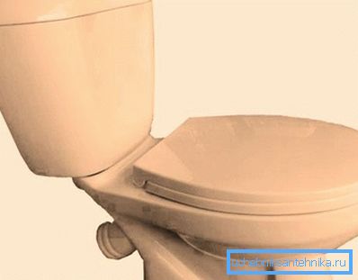 Beige toilet and the same sink with a bathroom will create a very pleasant composition Beige toilet and the same sink with a bathroom will create a very pleasant composition
