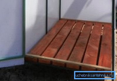 As a pallet, knocked down boards with some gaps for water flow are quite suitable. As a pallet, knocked down boards with some gaps for water flow are quite suitable.