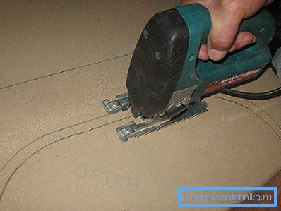 Cutting a hole with an electric jigsaw Cutting a hole with an electric jigsaw