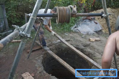 The pit is covered with a wooden shield.