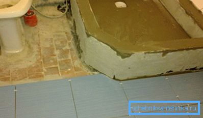 Fill a concrete screed and grout brick side walls.